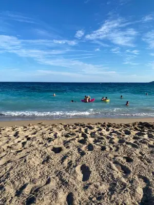 a group of people in the water at the beach at Apparemment proche de la mer in Cannes