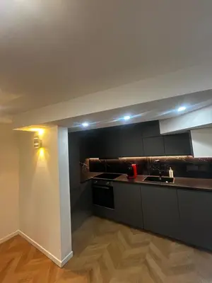 a kitchen with a sink and a stove top oven at La pause cannoise RDC in Cannes