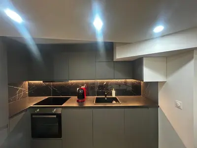 a kitchen with a sink and a stove at La pause cannoise RDC in Cannes