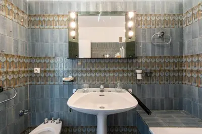 a bathroom with a sink and a mirror at Spacious 1-Br with Sea View Residence with Pool Cannes in Cannes