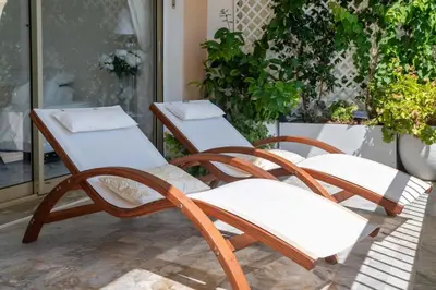 a couple of chairs sitting on a porch at Spacious 1-Br with Sea View Residence with Pool Cannes in Cannes