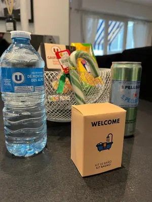 a bottle of water and a box on a counter at Family Flat Cannes Centre in Cannes