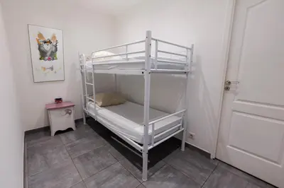 a room with a bunk bed in a room at Family Flat Cannes Centre in Cannes