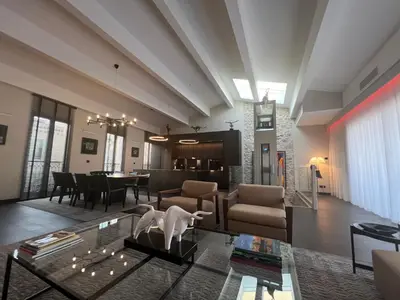 a living room with a couch and a table at Cannes hyper centre appartement luxe 5 étoiles terrasse in Cannes
