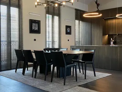 a dining room with a table and chairs at Cannes hyper centre appartement luxe 5 étoiles terrasse in Cannes