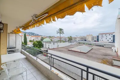 a balcony with a view of a city at LE BRISTOL avec balcon au calme en centre-ville in Cannes
