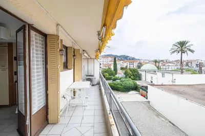 a balcony with a view of a city at LE BRISTOL avec balcon au calme en centre-ville in Cannes