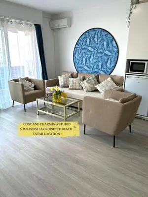 a living room with a couch and two chairs at Nid douillet près de la Croisette in Cannes