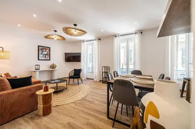 a living room with a couch and a table at Magnificent apartment - AC- 2BR- 4P - Cannes in Cannes