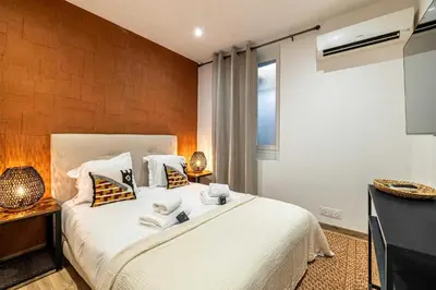 a bedroom with a large white bed and a window at Magnificent apartment - AC- 2BR- 4P - Cannes in Cannes