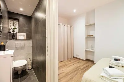 a small bathroom with a toilet and a sink at Magnificent apartment - AC- 2BR- 4P - Cannes in Cannes