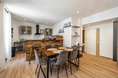 a kitchen and dining room with a table and chairs at Magnificent apartment - AC- 2BR- 4P - Cannes in Cannes
