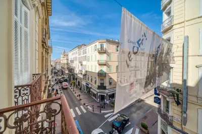 a view of a city street from a balcony at REF 1412 - Cannes Center - Apartment for rent in Cannes