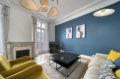 a living room with a couch and a table at REF 1412 - Cannes Center - Apartment for rent in Cannes