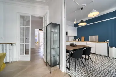 a kitchen and dining room with a table and chairs at REF 1412 - Cannes Center - Apartment for rent in Cannes
