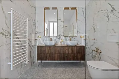 a bathroom with two sinks and a mirror at REF 783 - Cannes Croisette - Apartment for rent in Cannes