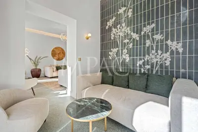 a living room with a couch and a table at REF 783 - Cannes Croisette - Apartment for rent in Cannes