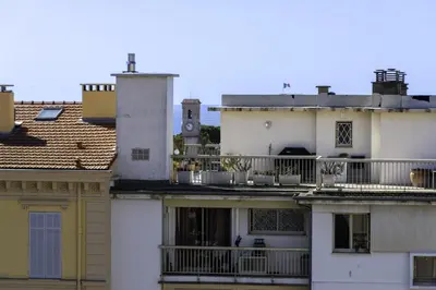 a group of white buildings with a balcony at Cozy T2 Centre Cannes proche Suquet in Cannes