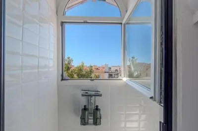 a window in a bathroom with two bottles at Cozy T2 Centre Cannes proche Suquet in Cannes