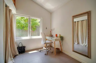 a room with a desk and a mirror and a window at FRGK Villa Bohème Chic Private Pool UltraFast WiFi in Le Cannet