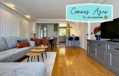 a living room with a couch and a table at Cannes Azur - SCLS Locations in Cannes