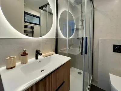a bathroom with a sink and a shower at Cannes Azur - SCLS Locations in Cannes