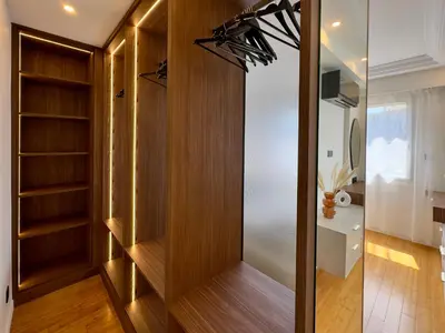 a dressing room with wood paneling and a closet at Cannes Azur - SCLS Locations in Cannes