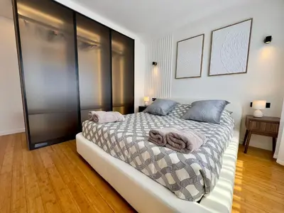 a bedroom with a bed with two towels on it at Cannes Azur - SCLS Locations in Cannes
