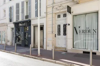 a row of store fronts on a city street at L'Ecrin Festivalier Standing Presta in Cannes