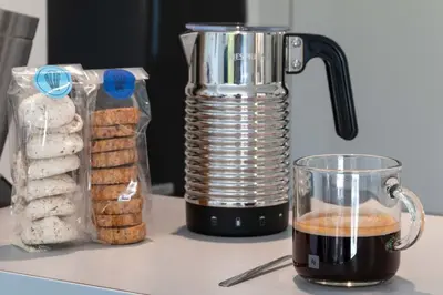 a blender sitting on a counter next to a container of cookies at 1-Br Garden Apartment with Pool Peaceful Private Parking in Cannes