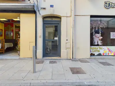 a building with a door on the side of a street at Centre Cannes Serbes in Cannes