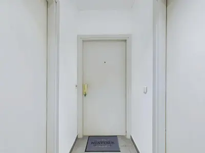 a white door with a sign in front of it at Centre Cannes Serbes in Cannes