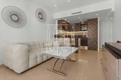 a living room with a white couch and a table at REF 2019 - Apartment for rent Cannes Center in Cannes
