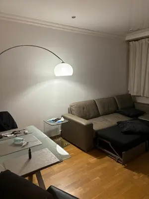 a living room with a couch and a table at Lovely 2 pièces Croisette Martinez in Cannes
