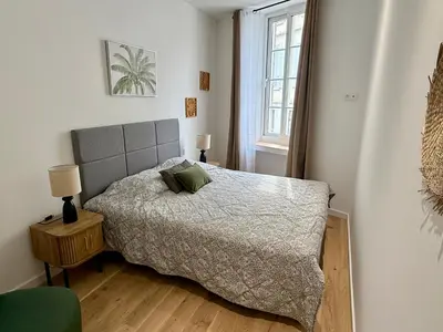 a bedroom with a bed and a window at Lumière by Connexion in Cannes