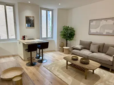 a living room with a piano and a couch at Lumière by Connexion in Cannes