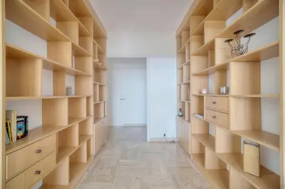 a room with wooden shelves and a hallway at Immogroom - 1 Bedroom - Sea view- AC in Cannes