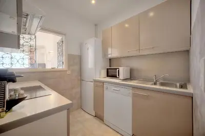 a kitchen with a sink and a microwave at Immogroom - 1 Bedroom - Sea view- AC in Cannes