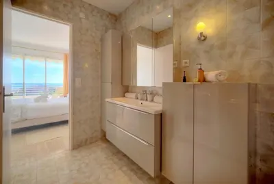a bathroom with a sink and a mirror at Immogroom - 1 Bedroom - Sea view- AC in Cannes