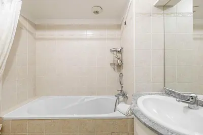 a bathroom with a tub and a sink at Bright One bedroom Apt with Parking and Terrace in Cannes
