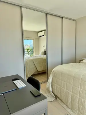 two chairs and a coffee table and a piano at Horizon by Connexion in Cannes