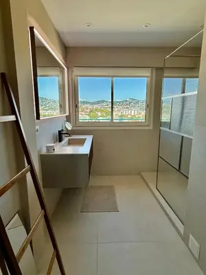 a living room with a couch and a table at Horizon by Connexion in Cannes