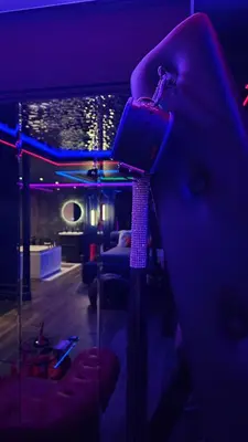 a room with blue and purple lights on the wall at Love room - Xtase By luxuria Cannes in Cannes