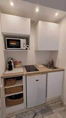 a kitchen with a sink and a microwave at Beau studio centre Cannes Maréchal Juin in Cannes