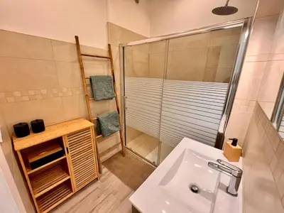 a bathroom with a shower and a sink at Cannes centre - Forville Market in Cannes