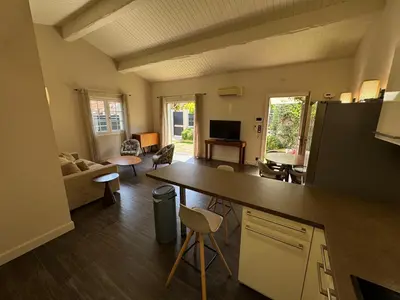 a kitchen and living room with a large counter top at The Mazet in Cannes