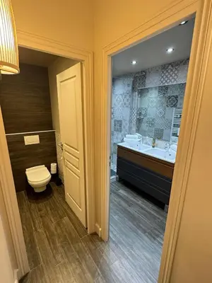 a bathroom with a toilet and a sink and a tub at The Mazet in Cannes