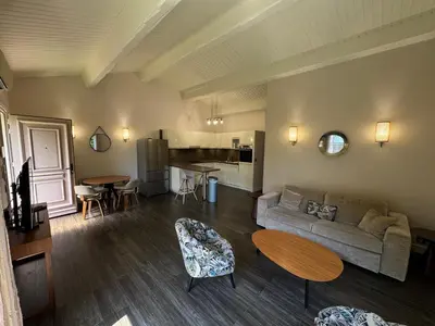 a living room with a couch and a table at The Mazet in Cannes