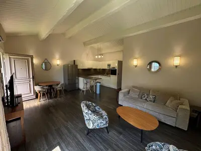 a living room with a couch and a table at The Mazet in Cannes