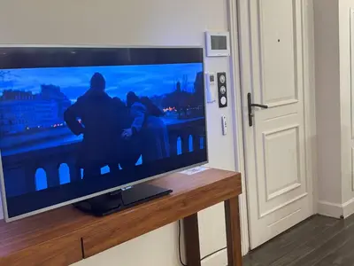 a flat screen tv hanging on a wall at The Mazet in Cannes